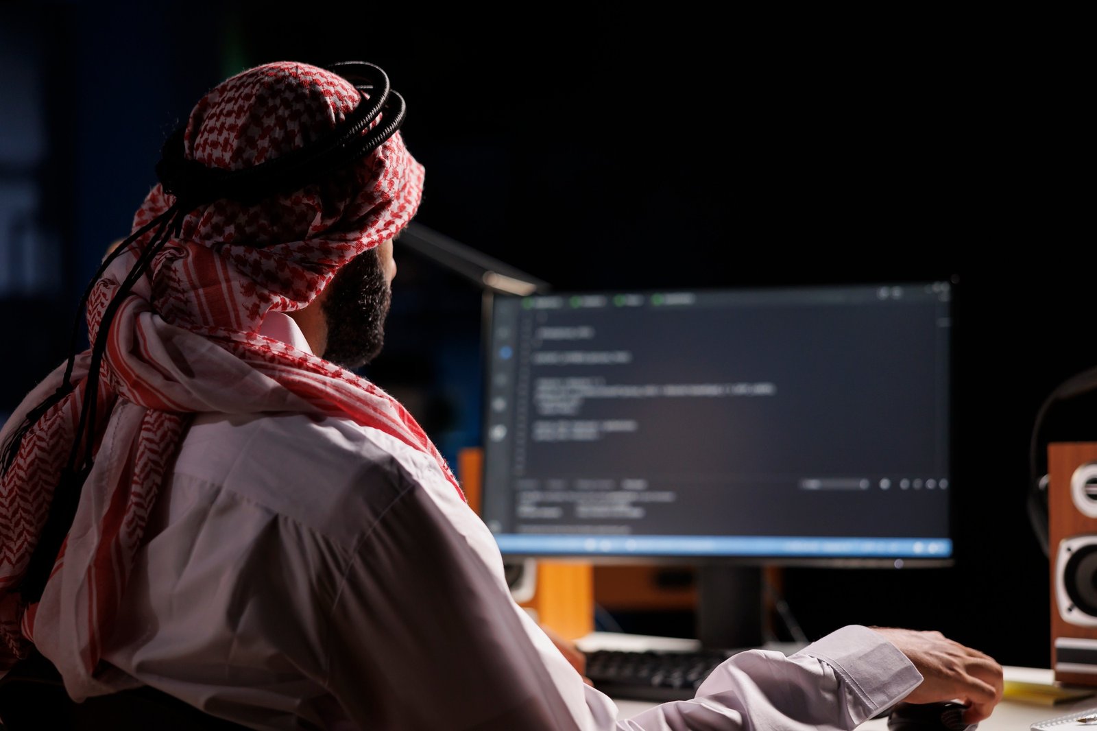 Arab Developer Compiling Code